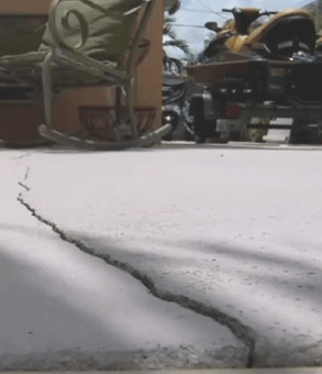 A concrete floor showing a big crack on the surface